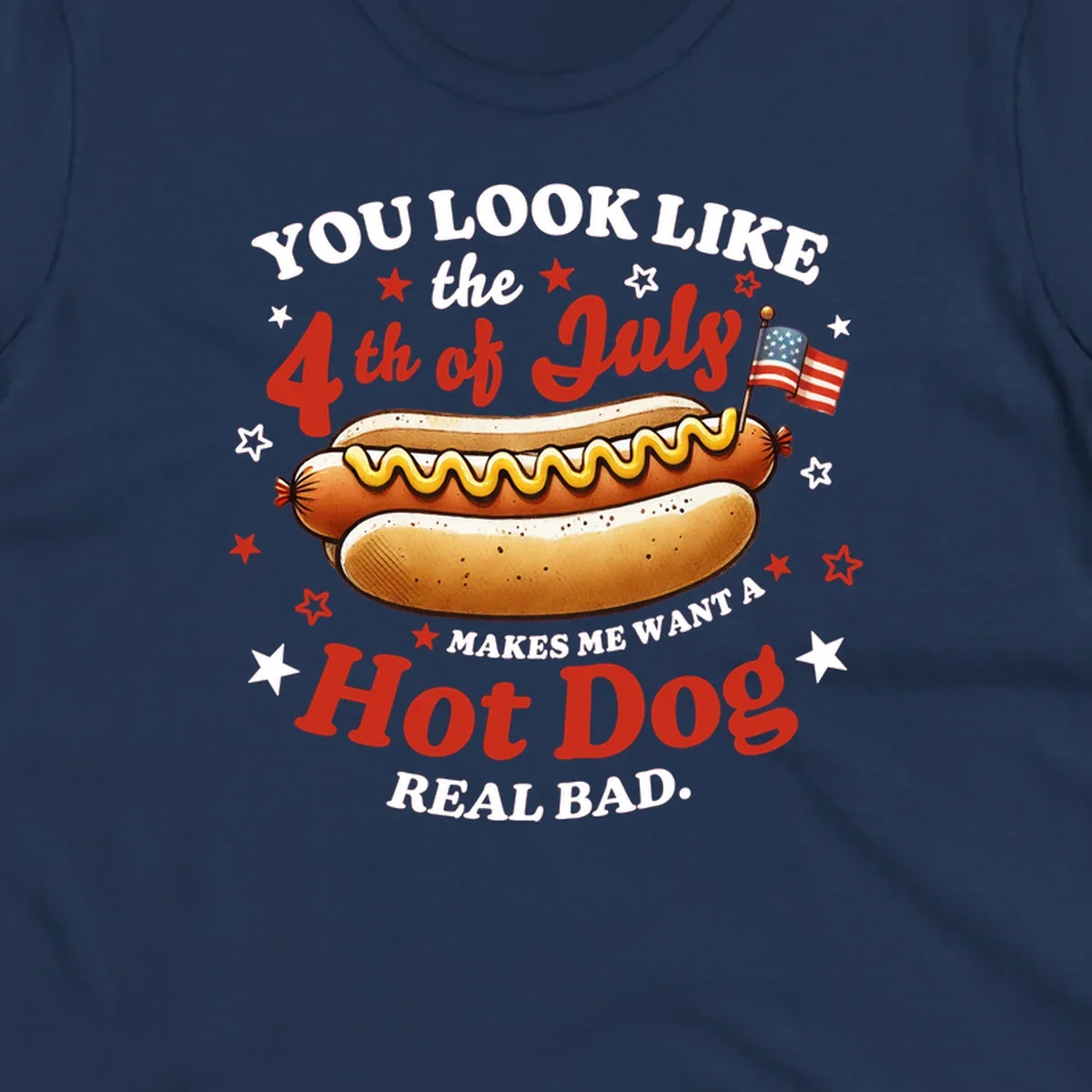 An illustrated hot dog with mustard, American flags, and stars. Text reads "YOU LOOK LIKE the 4th of July MAKES ME WANT A Hot Dog REAL BAD." you-look-like-4th-july design.