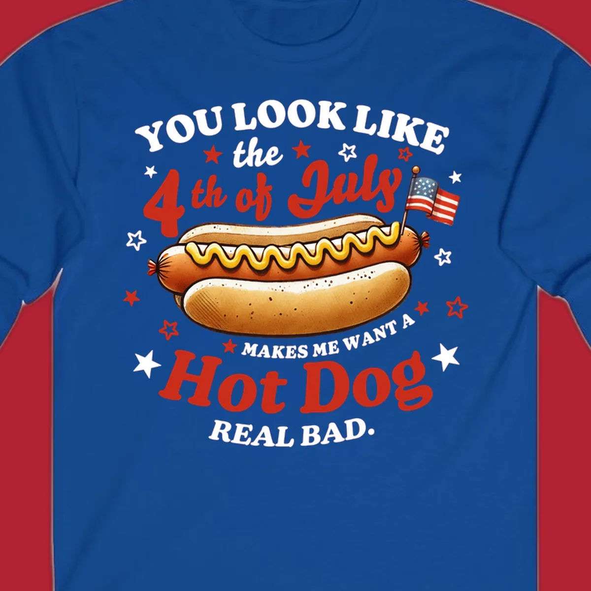 An illustrated hot dog with mustard, American flags, and stars. Text reads "YOU LOOK LIKE the 4th of July MAKES ME WANT A Hot Dog REAL BAD." you-look-like-4th-july design.