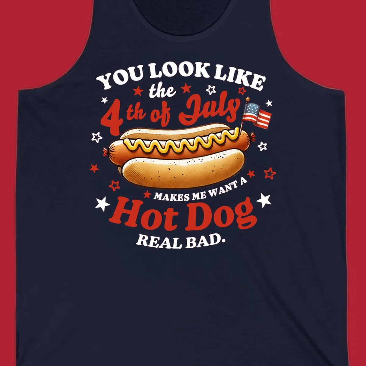 An illustrated hot dog with mustard, American flags, and stars. Text reads "YOU LOOK LIKE the 4th of July MAKES ME WANT A Hot Dog REAL BAD." you-look-like-4th-july design.