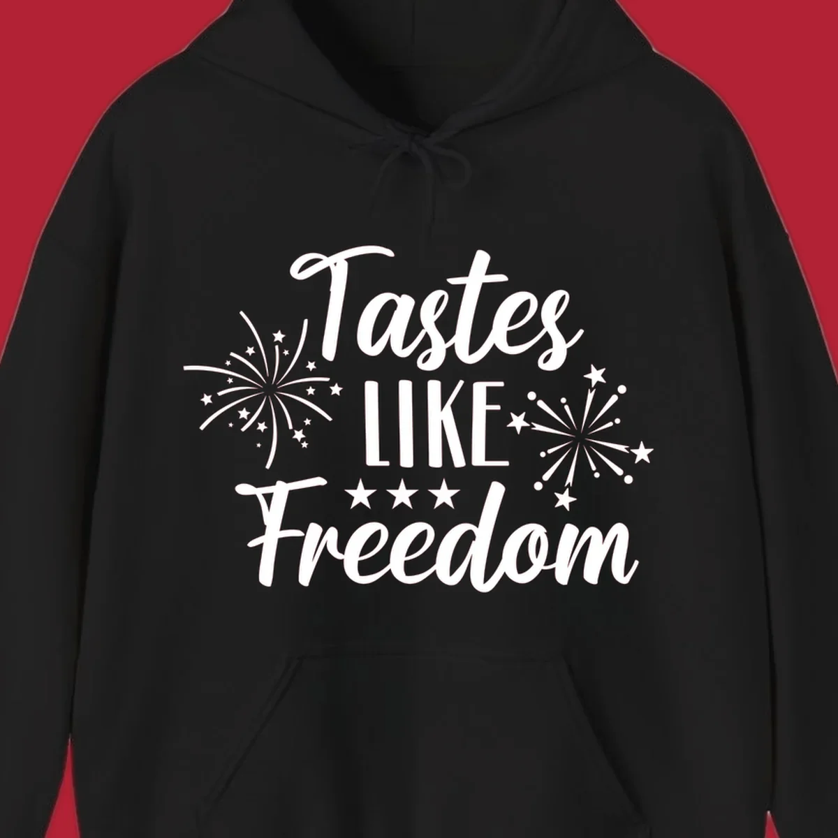 A patriotic design with the phrase 'Tastes LIKE Freedom' in script and block letters, surrounded by fireworks and stars.