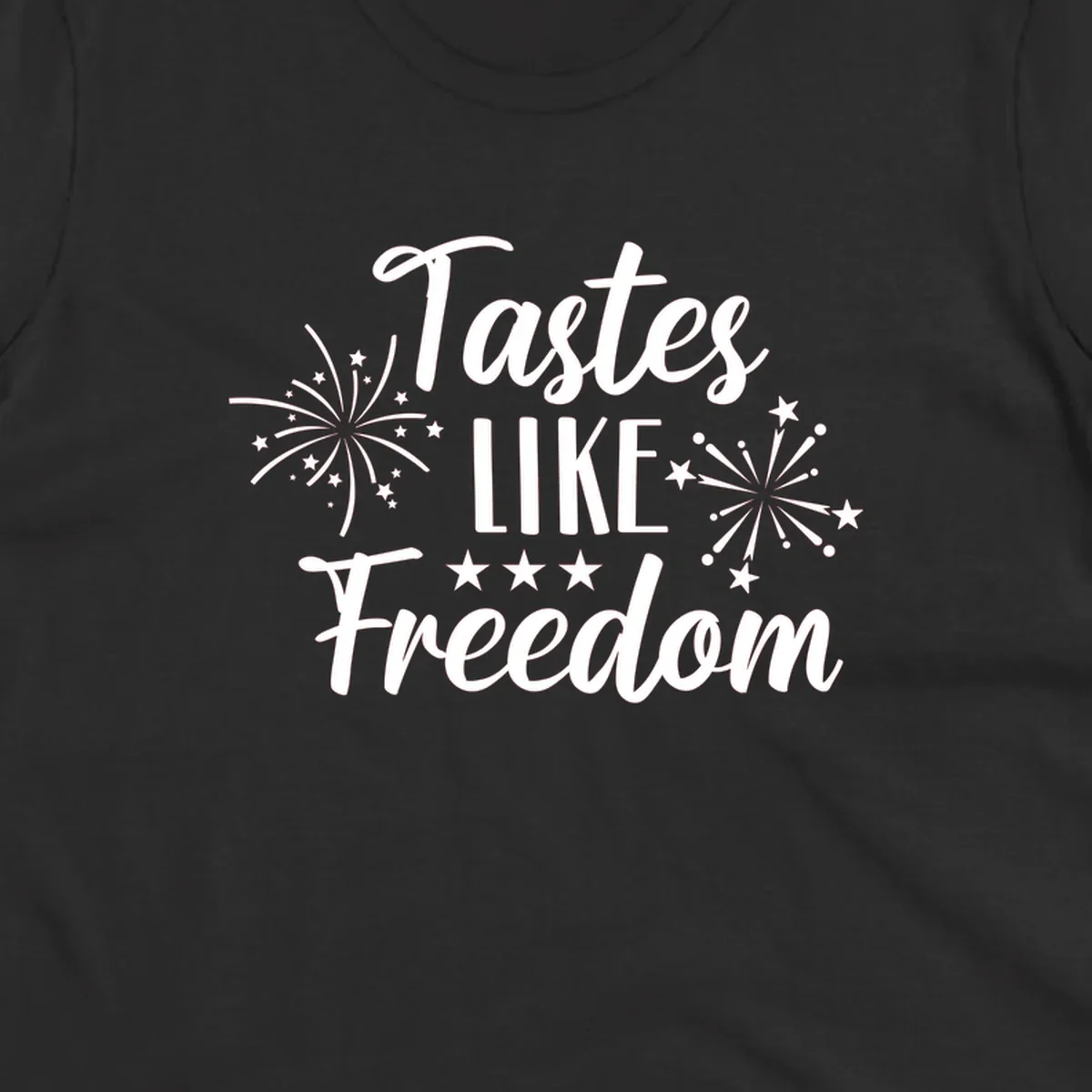 A patriotic design with the phrase 'Tastes LIKE Freedom' in script and block letters, surrounded by fireworks and stars.