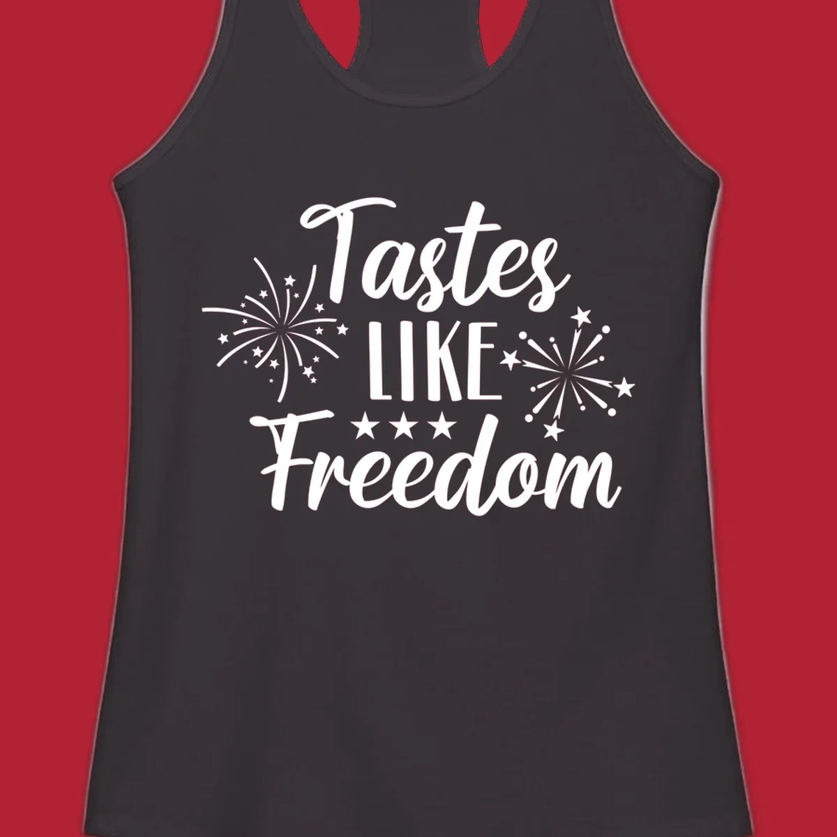 A patriotic design with the phrase 'Tastes LIKE Freedom' in script and block letters, surrounded by fireworks and stars.