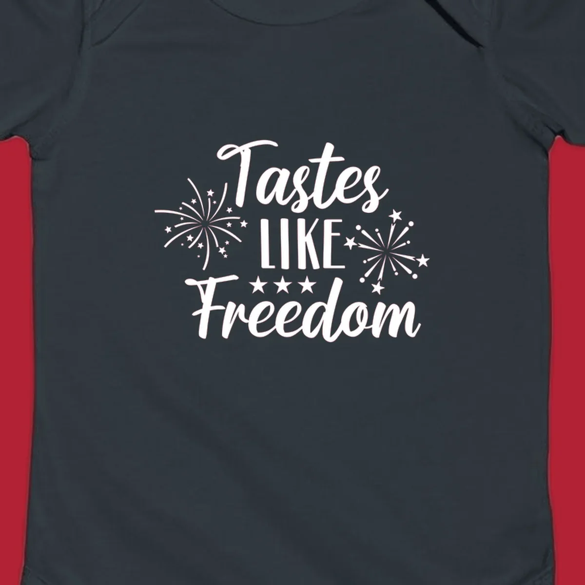 A patriotic design with the phrase 'Tastes LIKE Freedom' in script and block letters, surrounded by fireworks and stars.