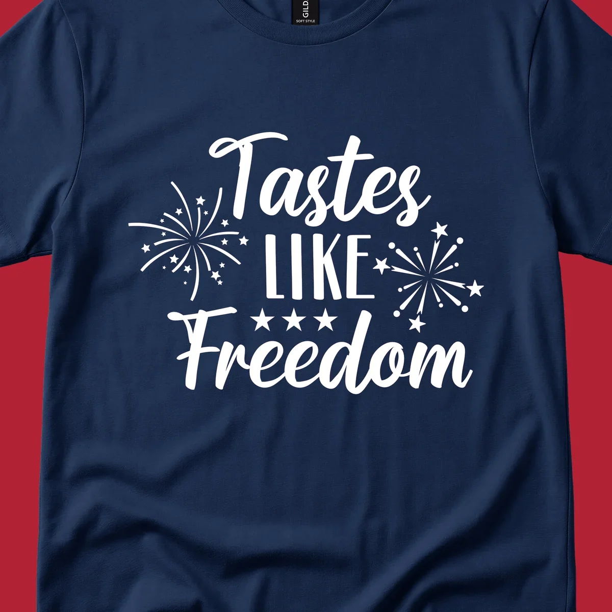 A patriotic design with the phrase 'Tastes LIKE Freedom' in script and block letters, surrounded by fireworks and stars.