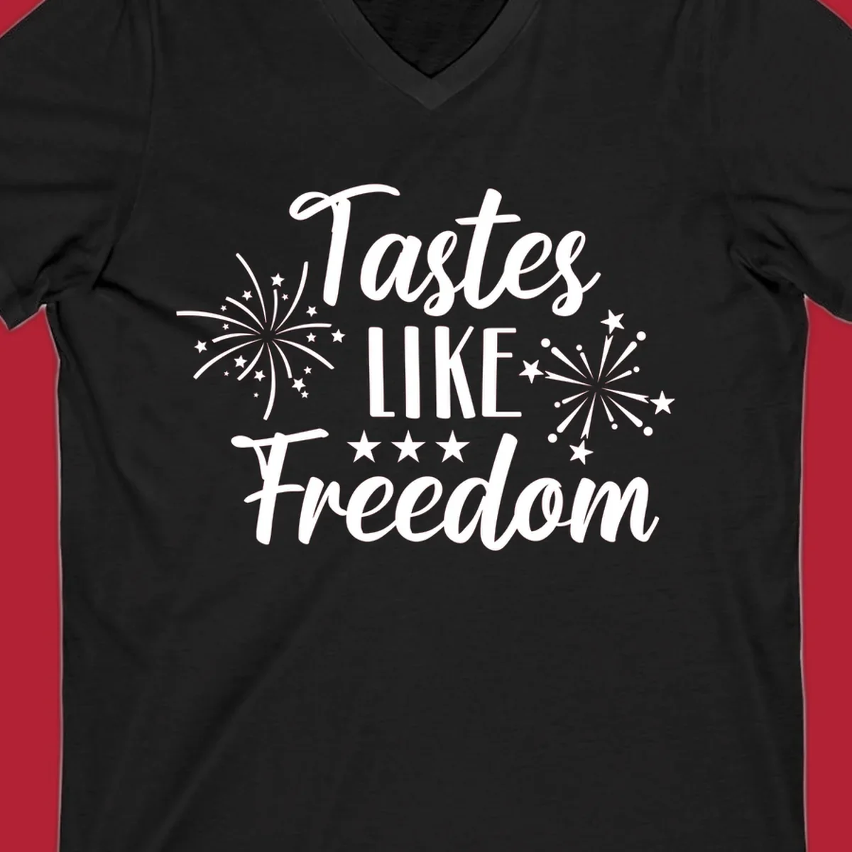 A patriotic design with the phrase 'Tastes LIKE Freedom' in script and block letters, surrounded by fireworks and stars.