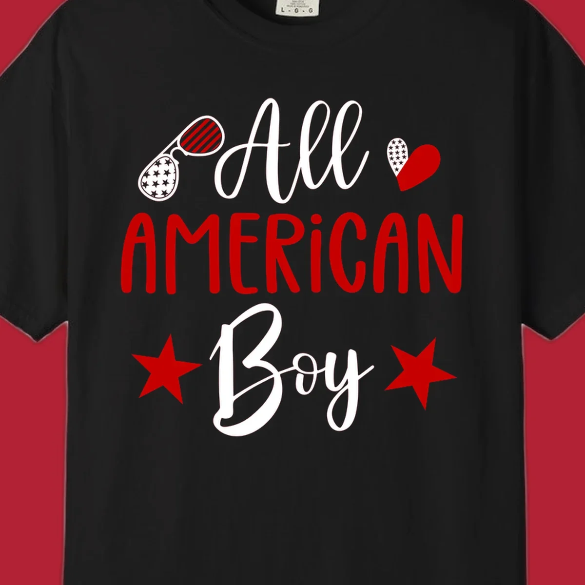 An 'All American Boy' design with patriotic sunglasses, a heart, and stars in red, white, and black.
