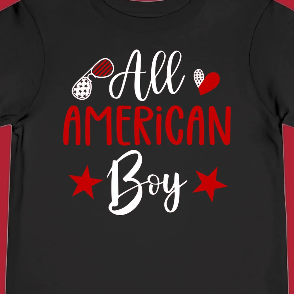 An 'All American Boy' design with patriotic sunglasses, a heart, and stars in red, white, and black.