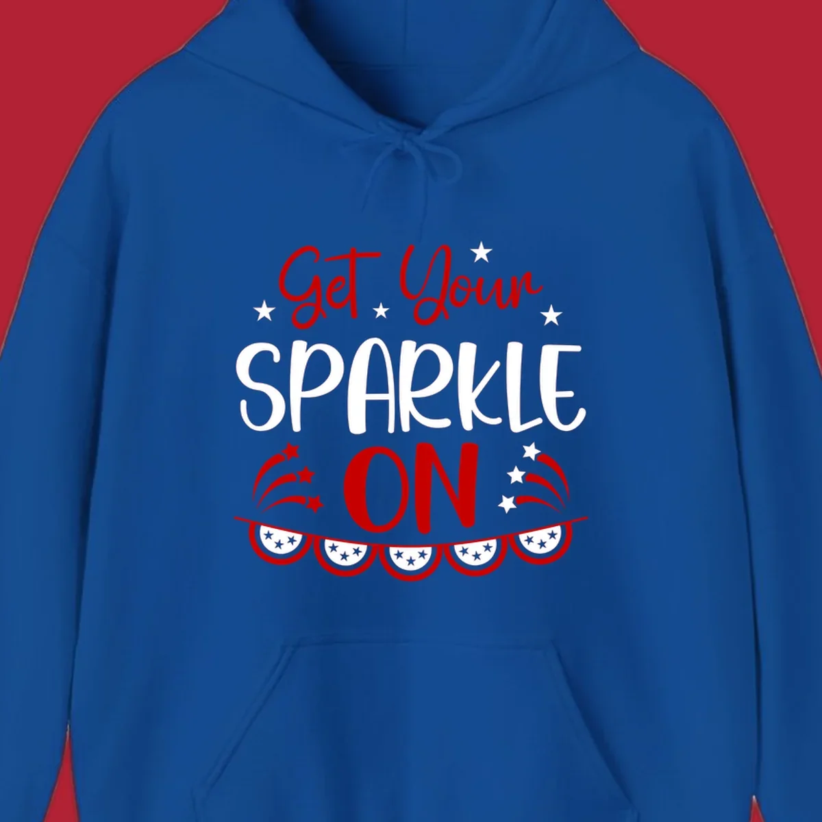 A patriotic design with the phrase 'Get Your SPARKLE ON' in red and blue, surrounded by white stars, fireworks, and bunting flags.