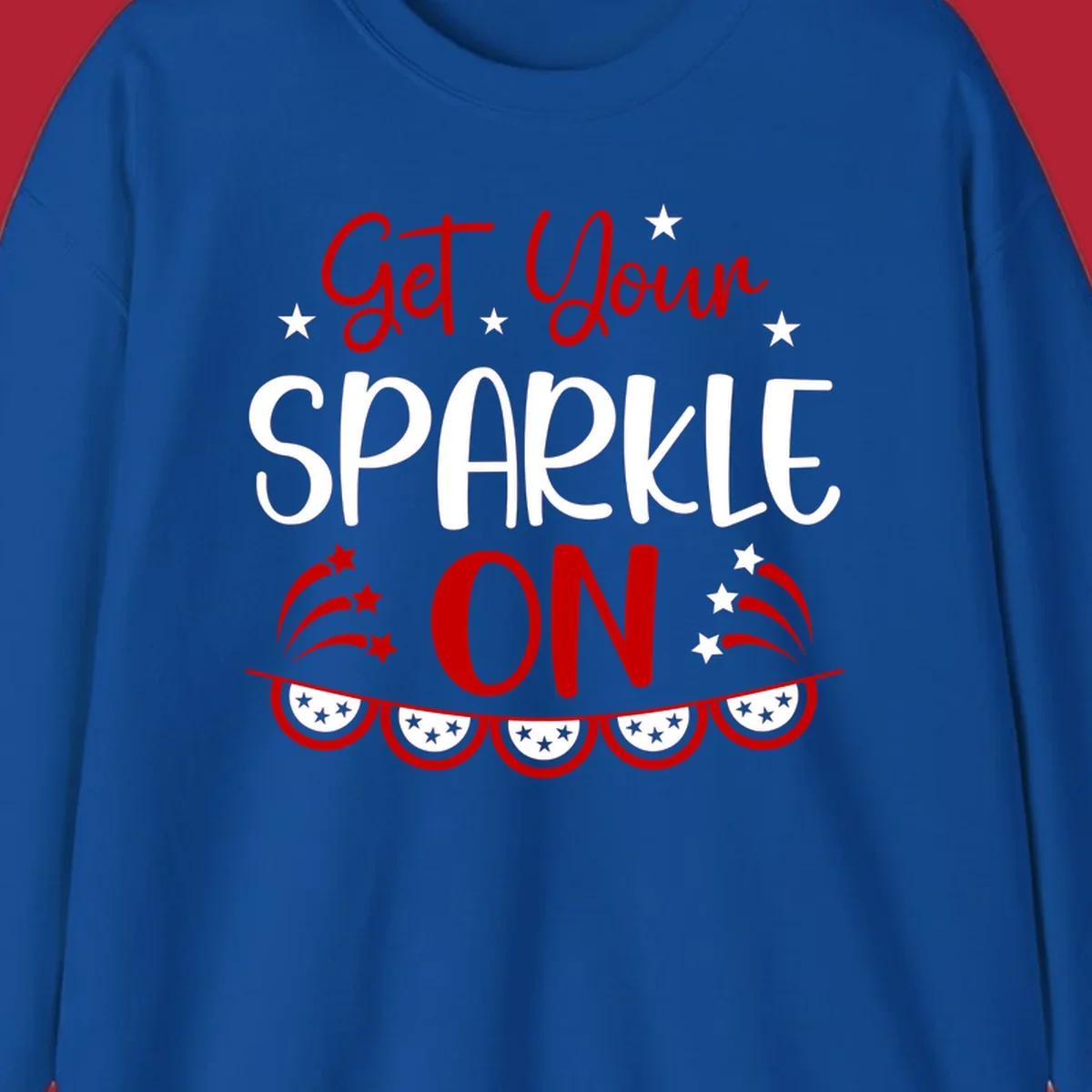 A patriotic design with the phrase 'Get Your SPARKLE ON' in red and blue, surrounded by white stars, fireworks, and bunting flags.