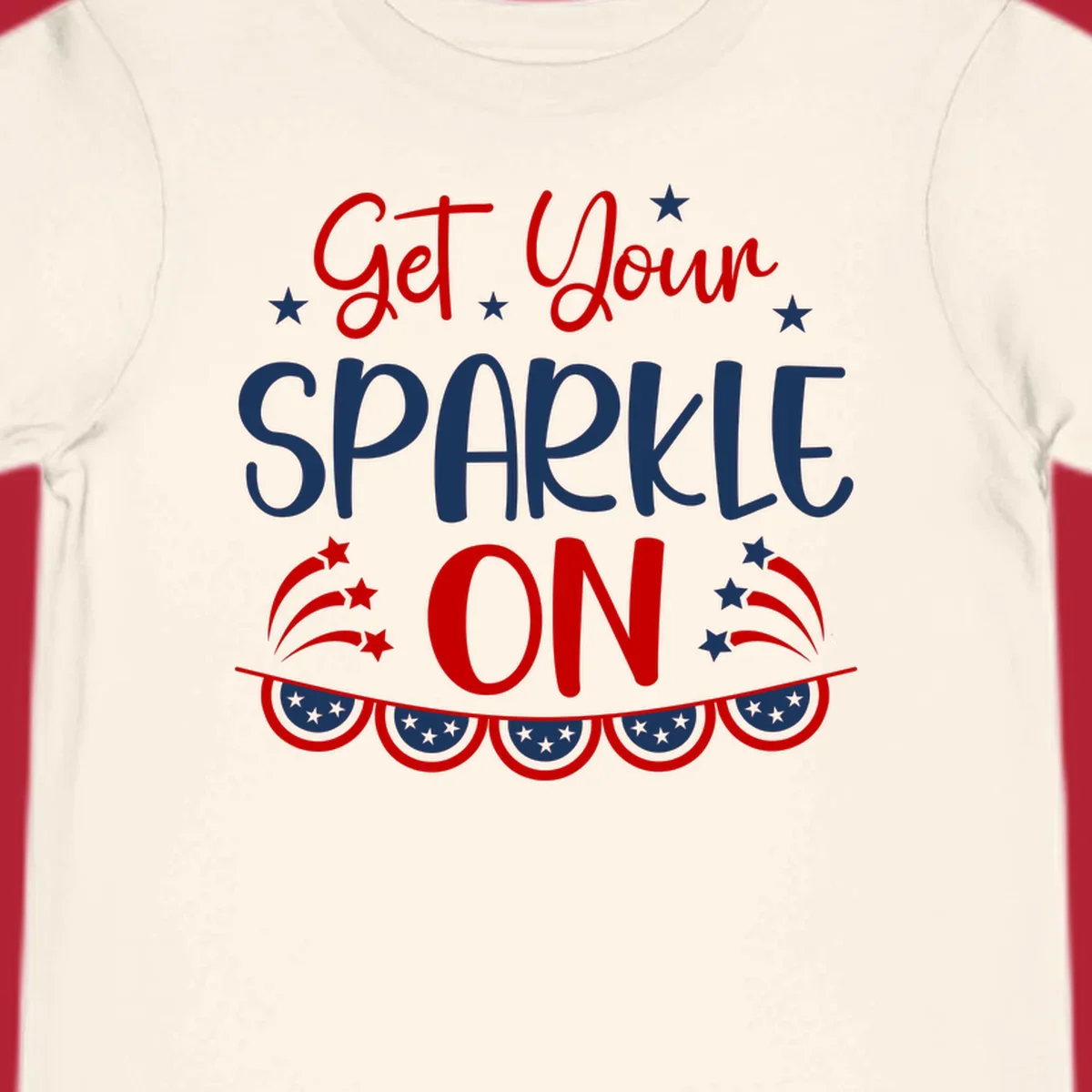 A patriotic design with the phrase 'Get Your SPARKLE ON' in red and blue, surrounded by white stars, fireworks, and bunting flags.