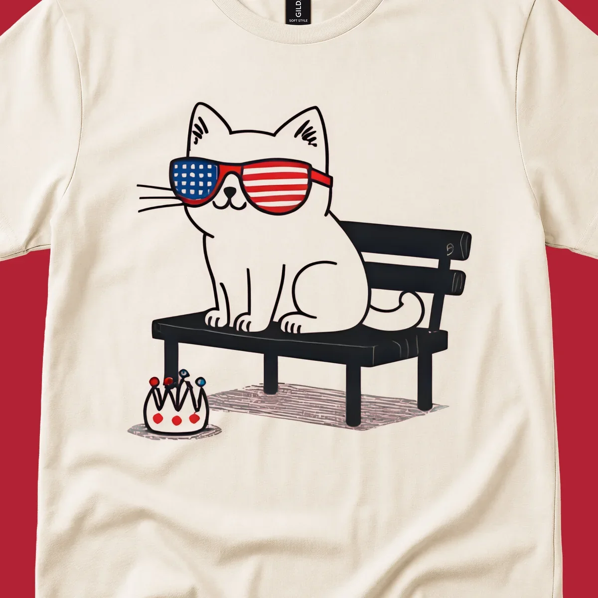 A black cat with American flag sunglasses sits on a bench, next to a small patriotic crown. Features a patriotic-cat-sunglasses concept.