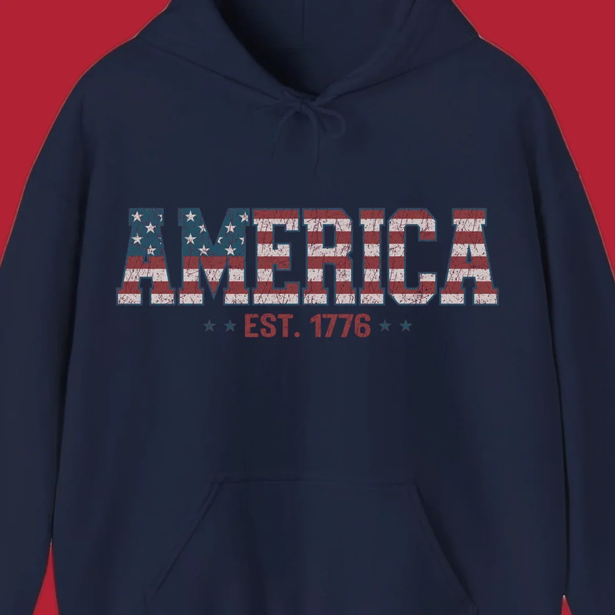 Distressed America Est. 1776 flag design with red, white, and blue flag pattern on block letters and stars.