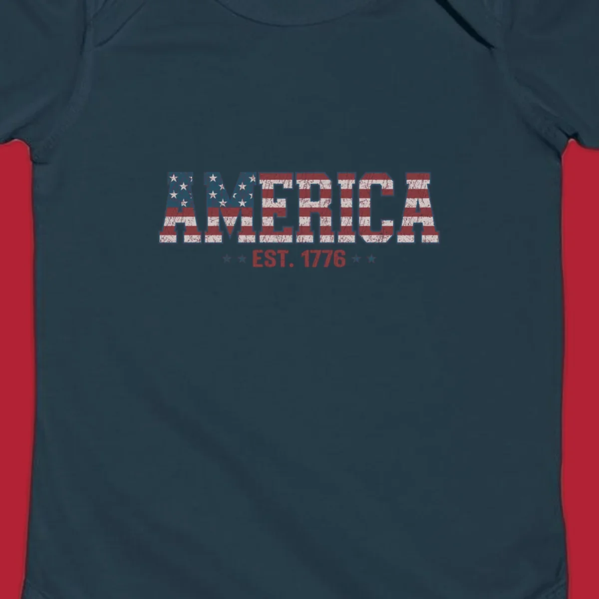 Distressed America Est. 1776 flag design with red, white, and blue flag pattern on block letters and stars.