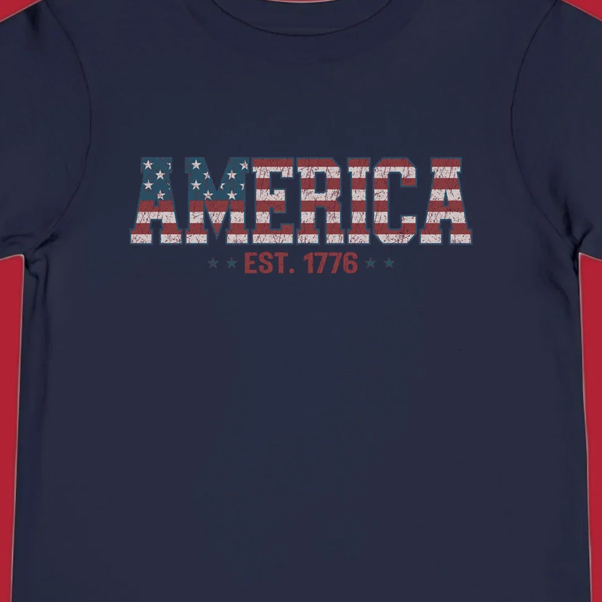 Distressed America Est. 1776 flag design with red, white, and blue flag pattern on block letters and stars.