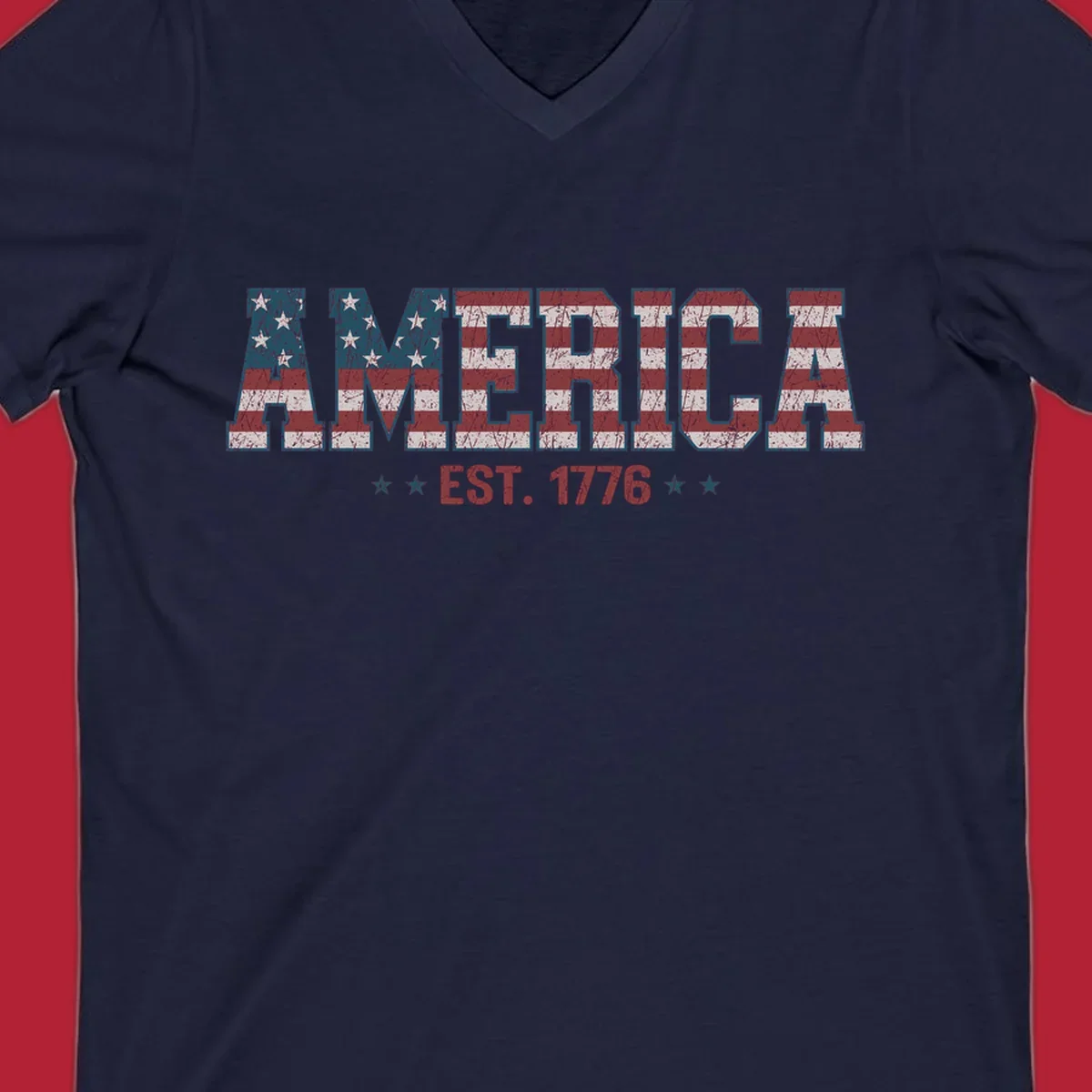 Distressed America Est. 1776 flag design with red, white, and blue flag pattern on block letters and stars.