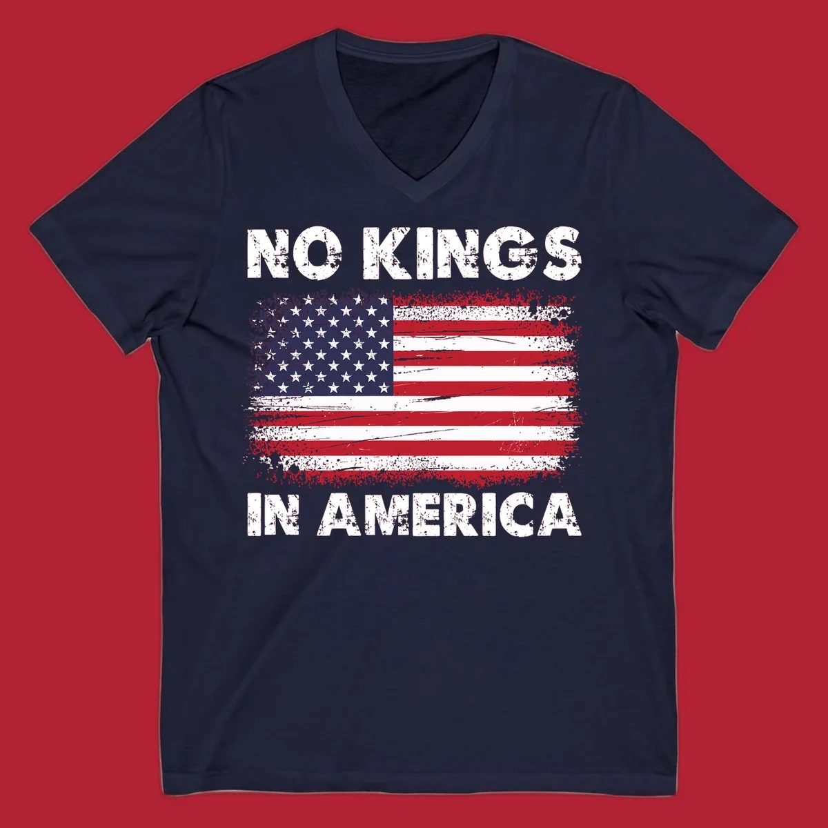 A distressed American flag with the white text 'NO KINGS IN AMERICA' above and below it.