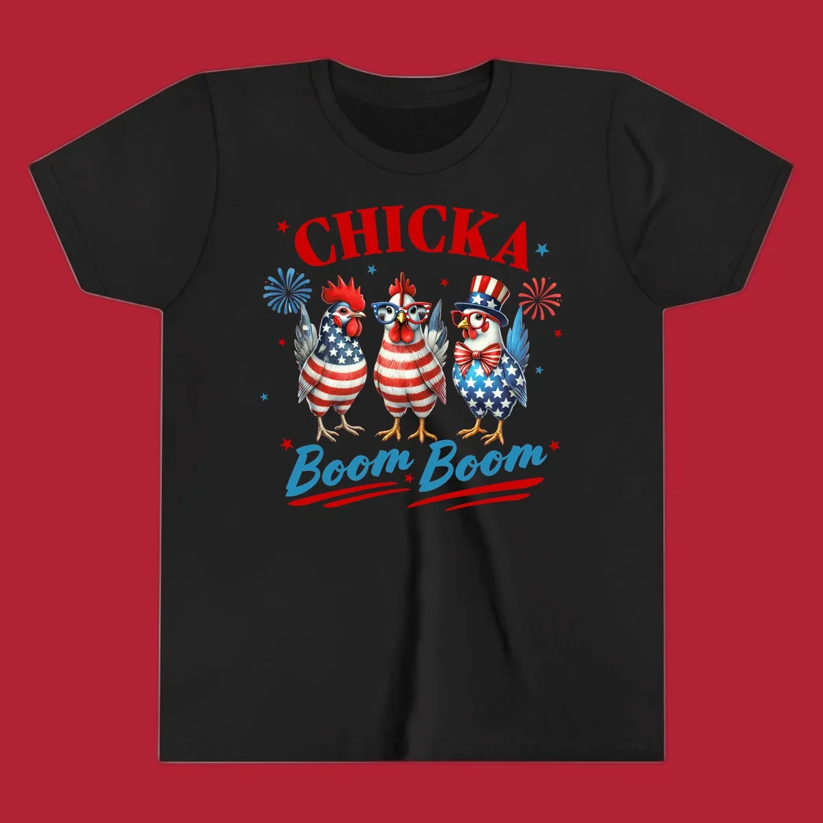 Three patriotic chickens in American flag patterns with fireworks and stars, text reads 'Chicka Boom Boom'. Features the chicka-boom-boom-patriotic-chickens concept.