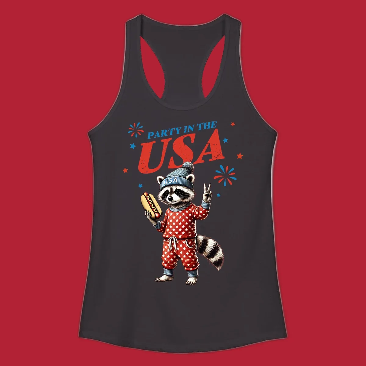 A cartoon raccoon wearing a USA beanie and star-patterned pajamas, holding a hotdog and making a peace sign, with 'PARTY IN THE USA' text and fireworks.