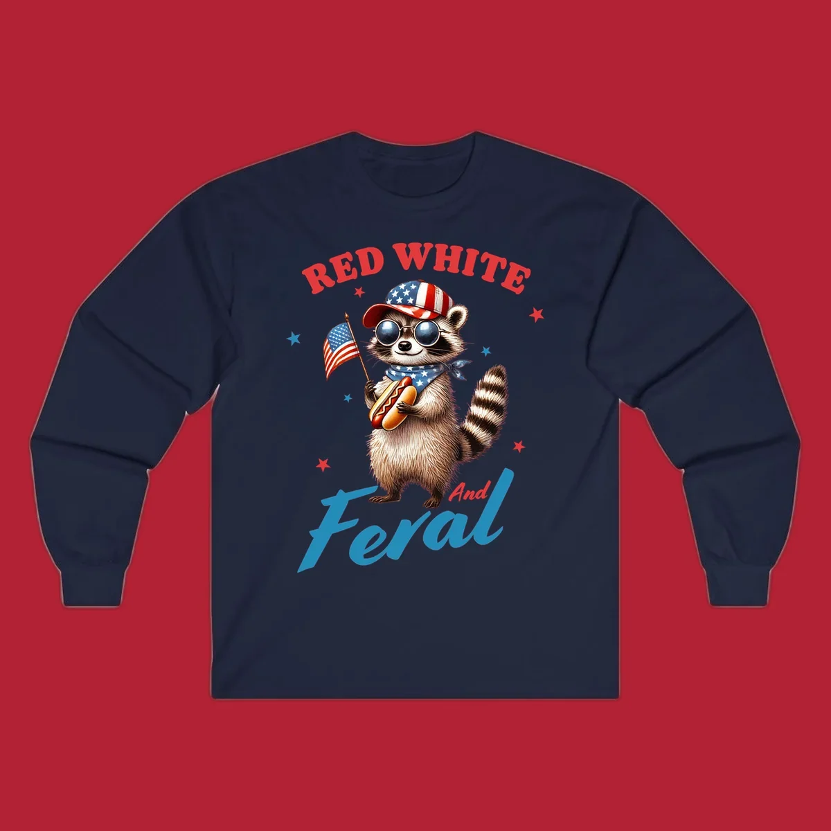 A cartoon raccoon wearing a patriotic hat and bandana, holding an American flag and a hot dog, with 'Red White And Feral' text. This is a red-white-feral-raccoon design.