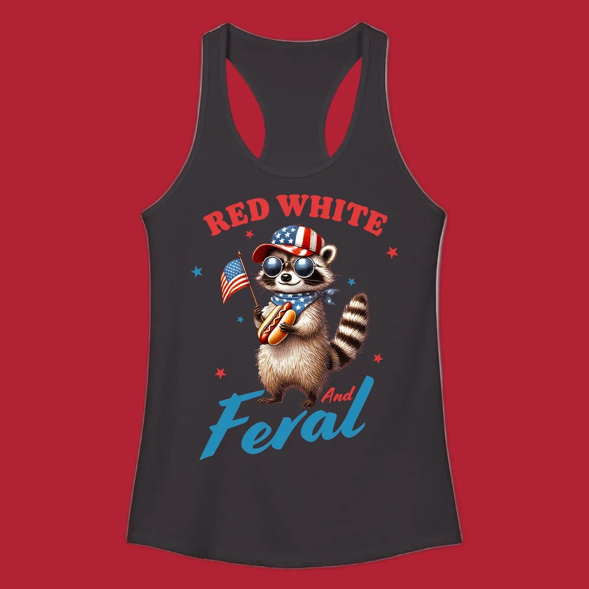 A cartoon raccoon wearing a patriotic hat and bandana, holding an American flag and a hot dog, with 'Red White And Feral' text. This is a red-white-feral-raccoon design.