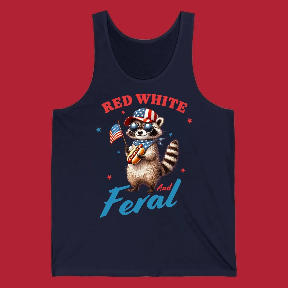 A cartoon raccoon wearing a patriotic hat and bandana, holding an American flag and a hot dog, with 'Red White And Feral' text. This is a red-white-feral-raccoon design.