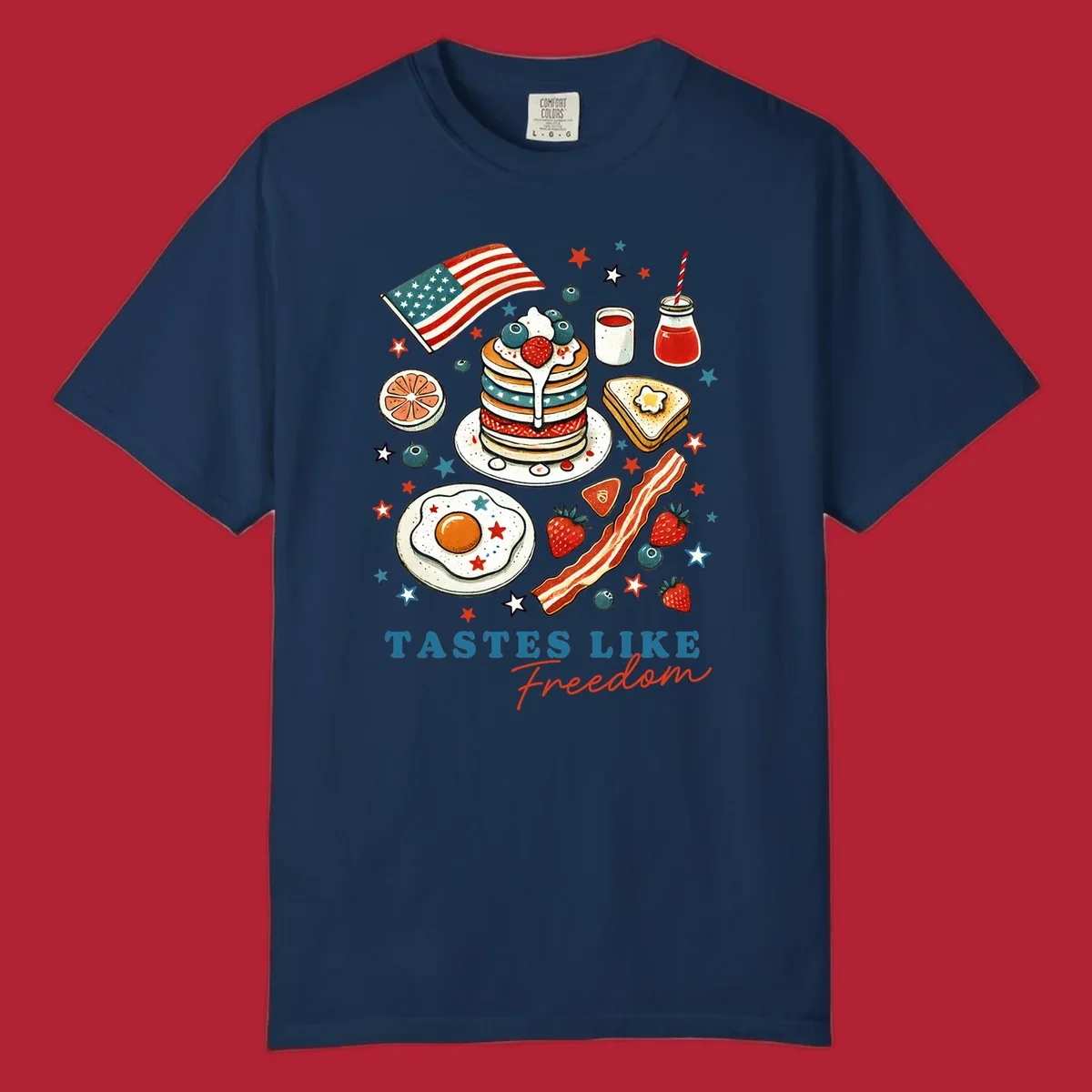 An illustration of a patriotic breakfast with an American flag, pancakes, bacon, eggs, and the text 'Tastes Like Freedom'.