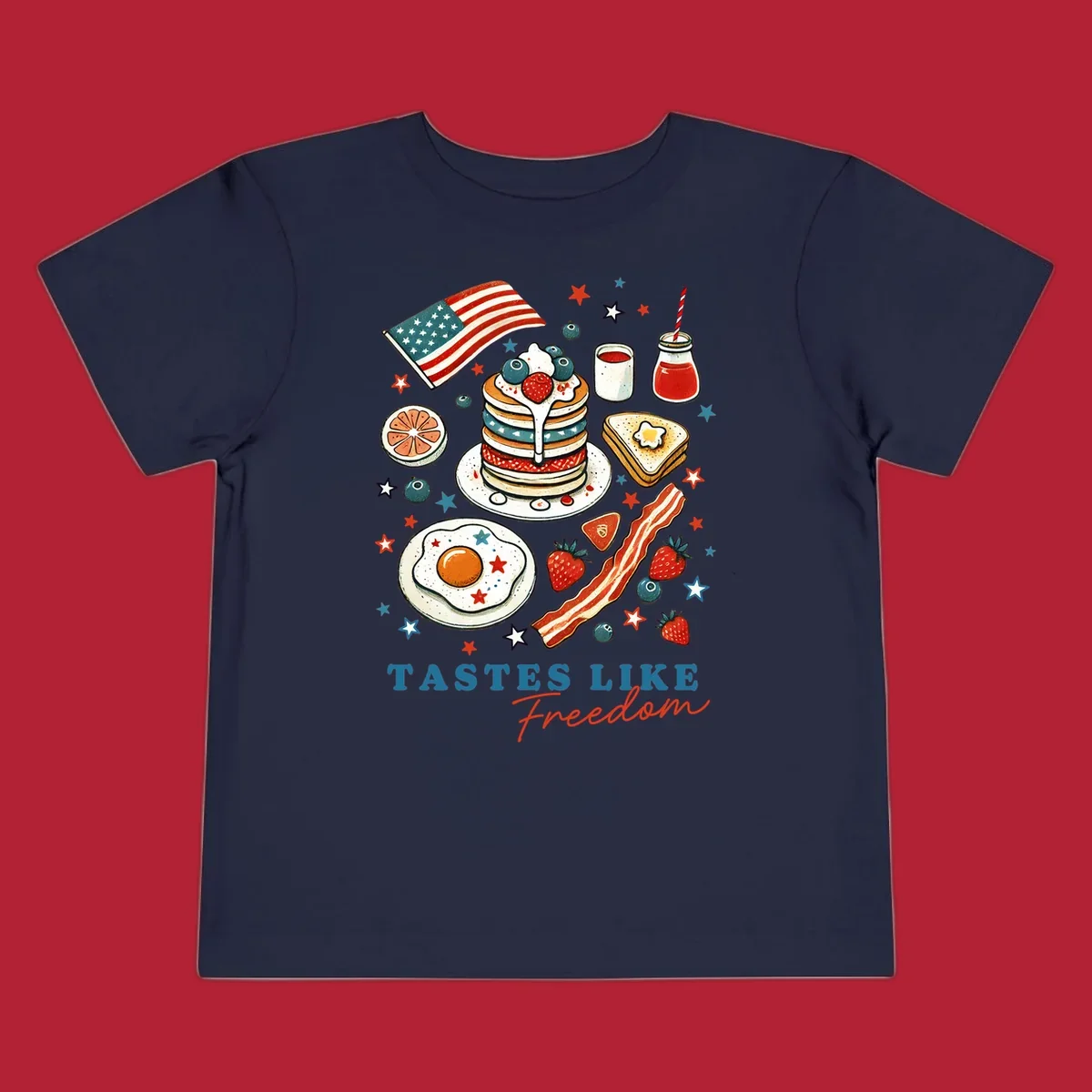 An illustration of a patriotic breakfast with an American flag, pancakes, bacon, eggs, and the text 'Tastes Like Freedom'.