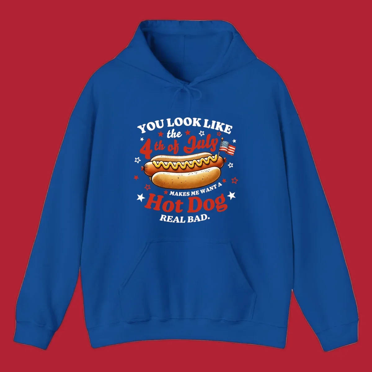 An illustrated hot dog with mustard, American flags, and stars. Text reads "YOU LOOK LIKE the 4th of July MAKES ME WANT A Hot Dog REAL BAD." you-look-like-4th-july design.