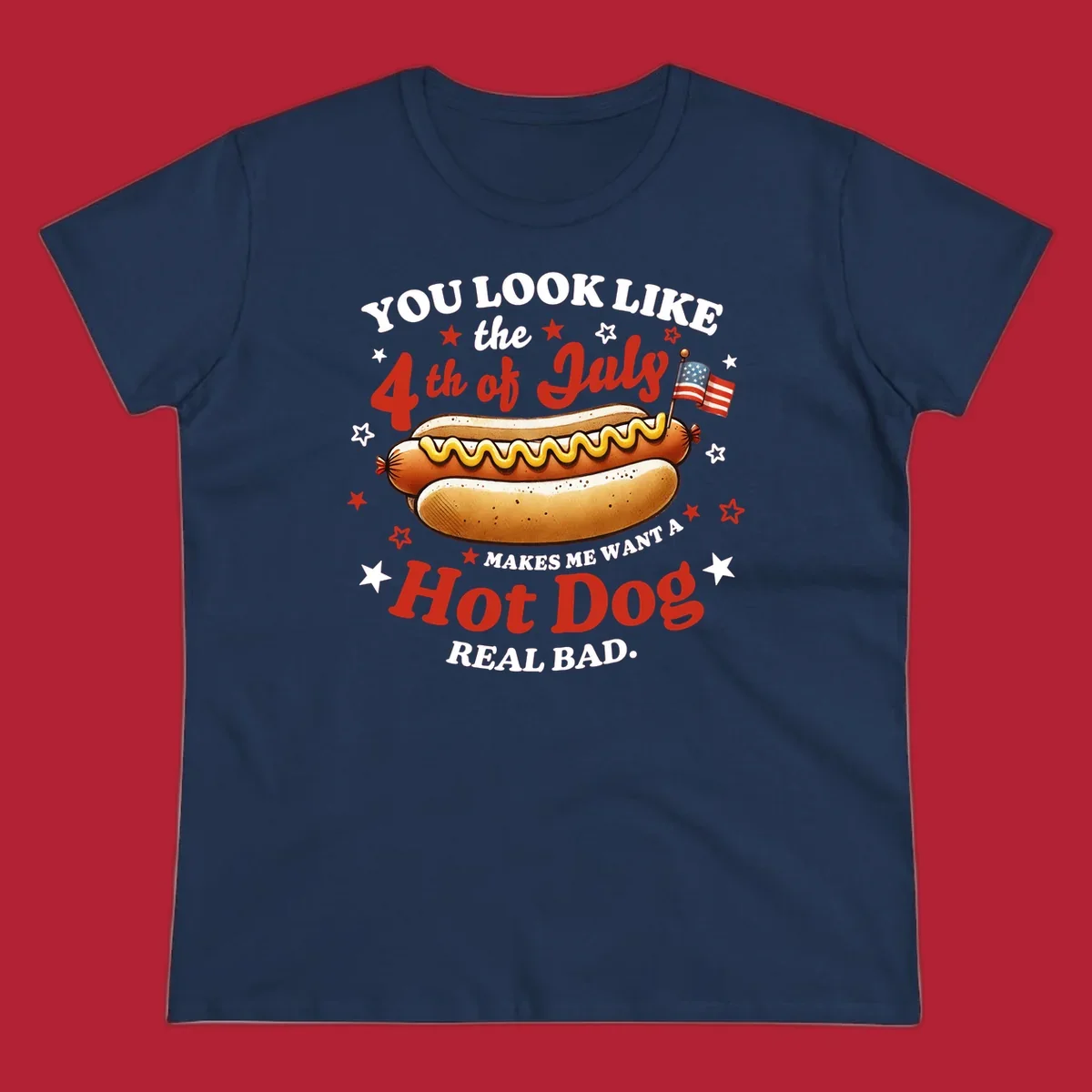 An illustrated hot dog with mustard, American flags, and stars. Text reads "YOU LOOK LIKE the 4th of July MAKES ME WANT A Hot Dog REAL BAD." you-look-like-4th-july design.