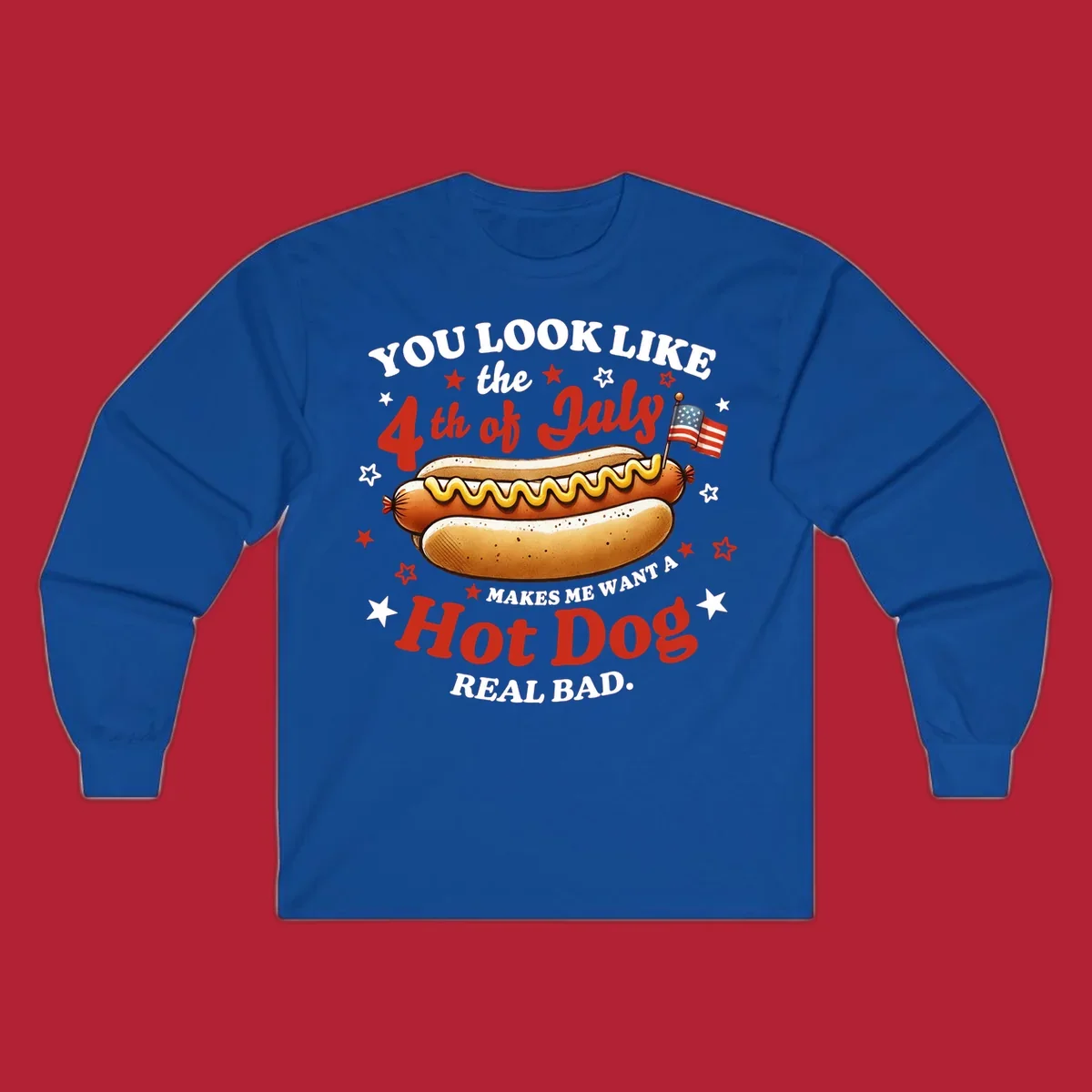 An illustrated hot dog with mustard, American flags, and stars. Text reads "YOU LOOK LIKE the 4th of July MAKES ME WANT A Hot Dog REAL BAD." you-look-like-4th-july design.