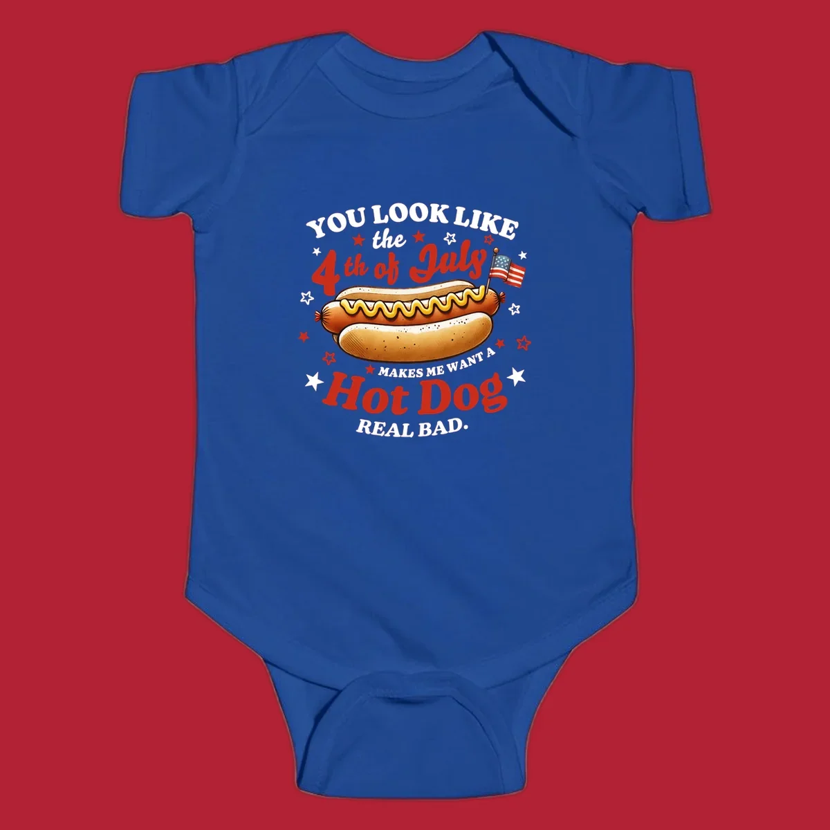 An illustrated hot dog with mustard, American flags, and stars. Text reads "YOU LOOK LIKE the 4th of July MAKES ME WANT A Hot Dog REAL BAD." you-look-like-4th-july design.