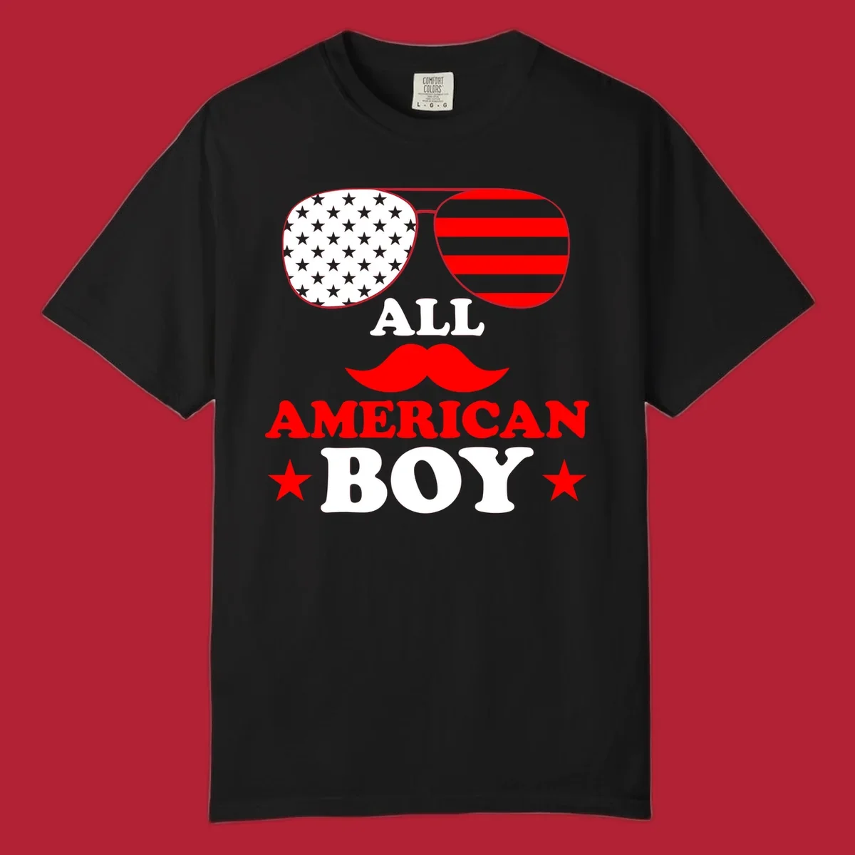 All American Boy patriotic design with aviator sunglasses featuring stars and stripes, a red mustache, and bold text.