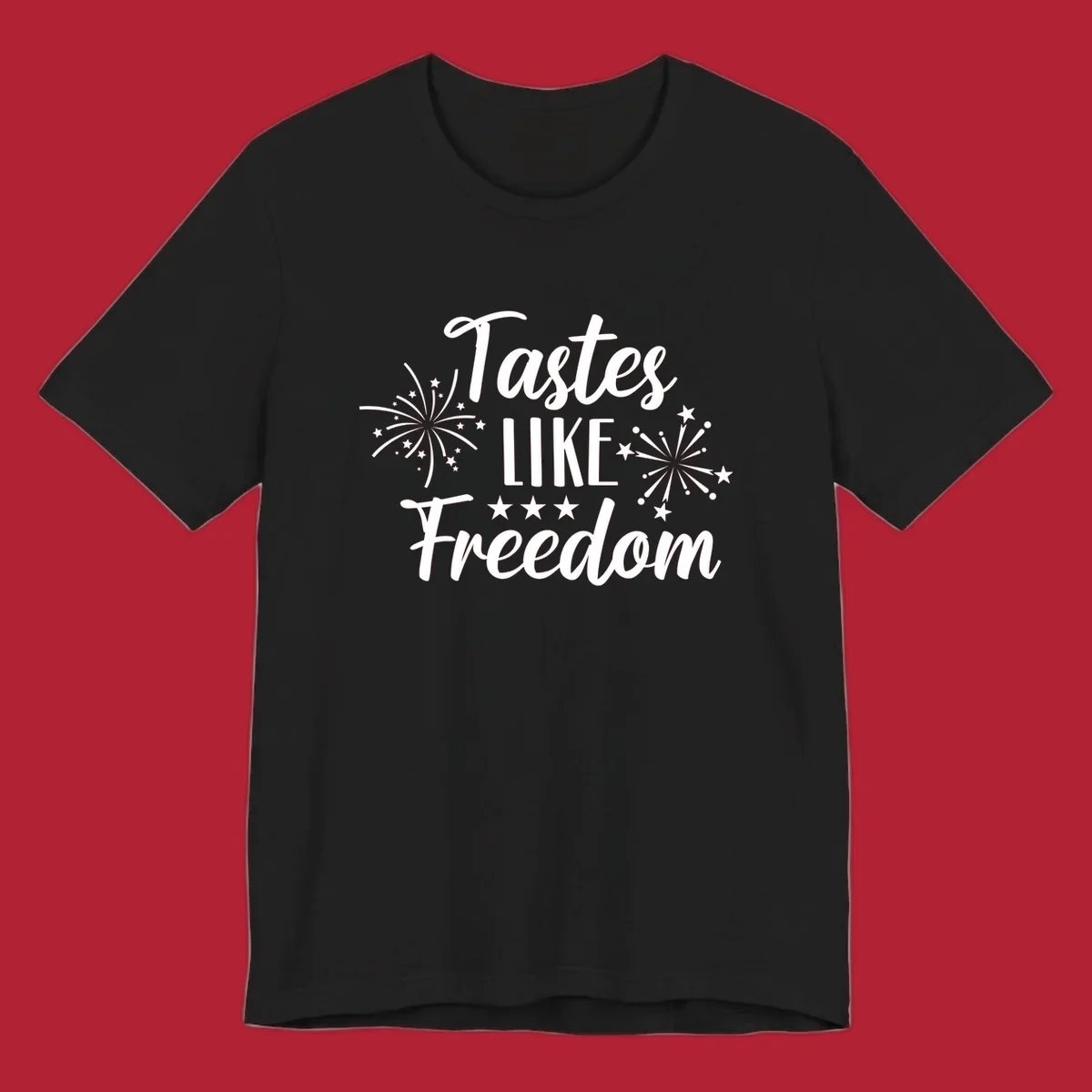 A patriotic design with the phrase 'Tastes LIKE Freedom' in script and block letters, surrounded by fireworks and stars.