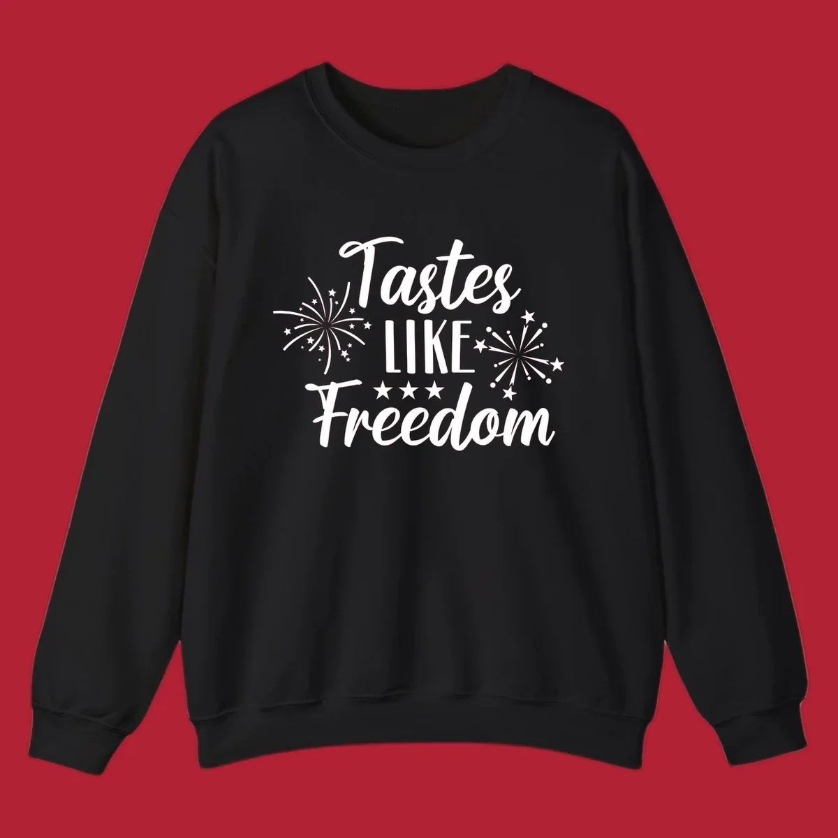 A patriotic design with the phrase 'Tastes LIKE Freedom' in script and block letters, surrounded by fireworks and stars.