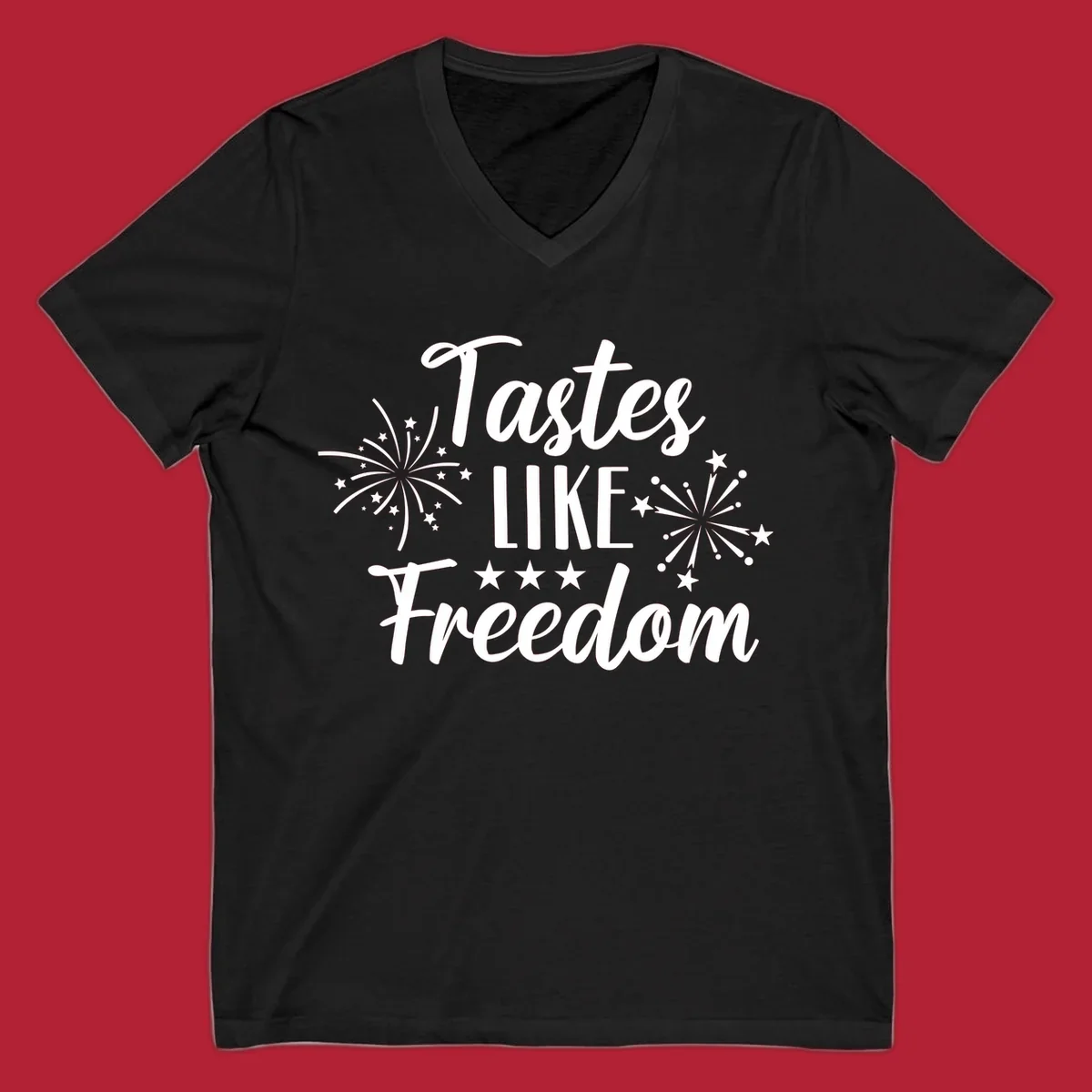A patriotic design with the phrase 'Tastes LIKE Freedom' in script and block letters, surrounded by fireworks and stars.
