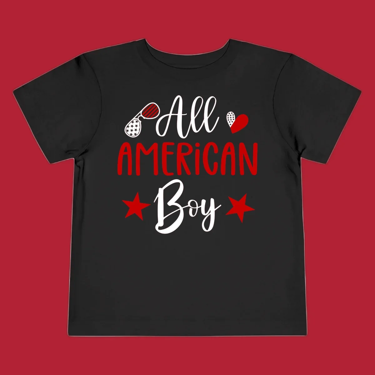 An 'All American Boy' design with patriotic sunglasses, a heart, and stars in red, white, and black.