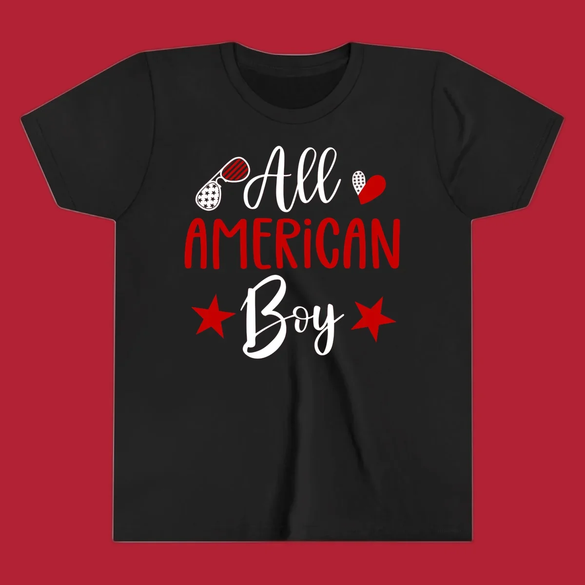 An 'All American Boy' design with patriotic sunglasses, a heart, and stars in red, white, and black.
