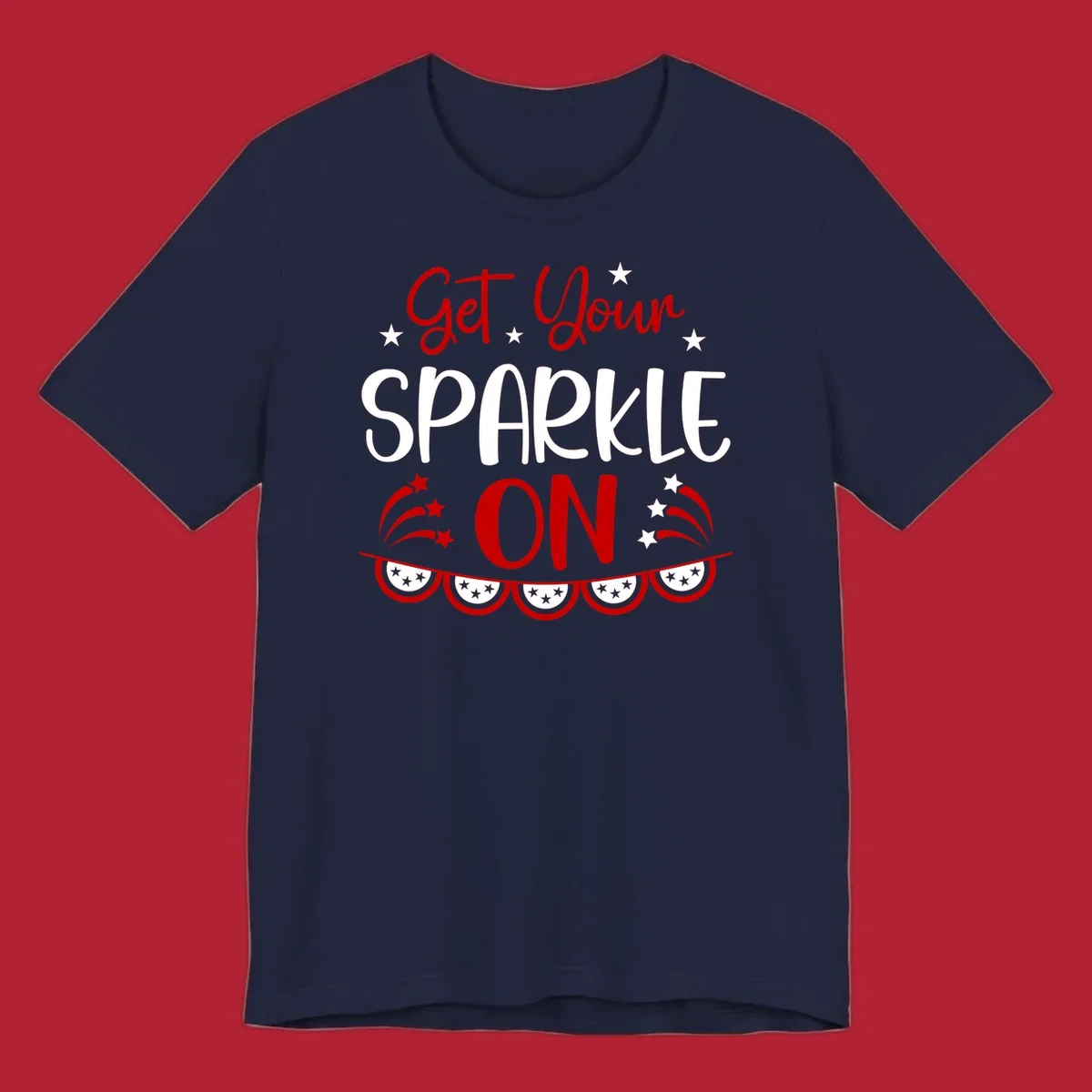 A patriotic design with the phrase 'Get Your SPARKLE ON' in red and blue, surrounded by white stars, fireworks, and bunting flags.