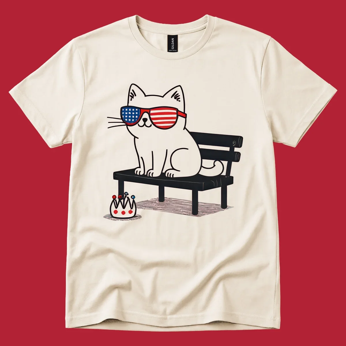 A black cat with American flag sunglasses sits on a bench, next to a small patriotic crown. Features a patriotic-cat-sunglasses concept.