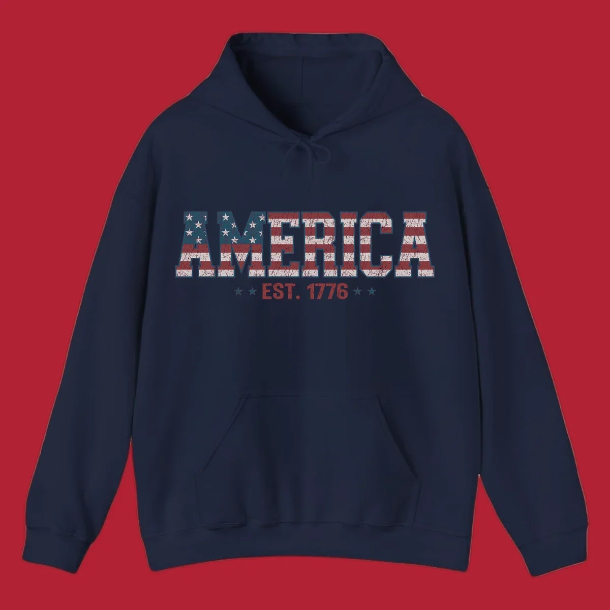 Distressed America Est. 1776 flag design with red, white, and blue flag pattern on block letters and stars.
