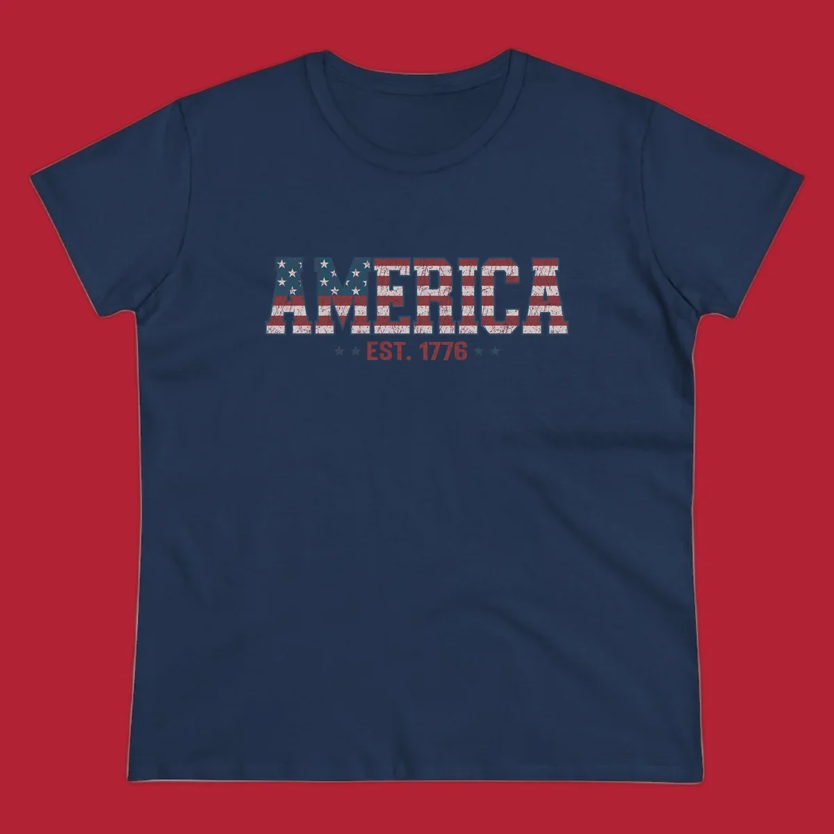 Distressed America Est. 1776 flag design with red, white, and blue flag pattern on block letters and stars.