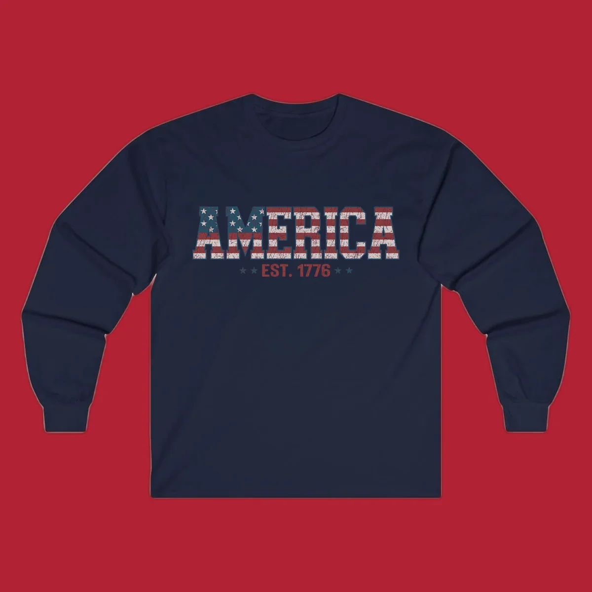 Distressed America Est. 1776 flag design with red, white, and blue flag pattern on block letters and stars.