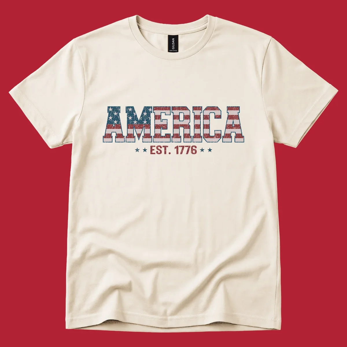Distressed America Est. 1776 flag design with red, white, and blue flag pattern on block letters and stars.