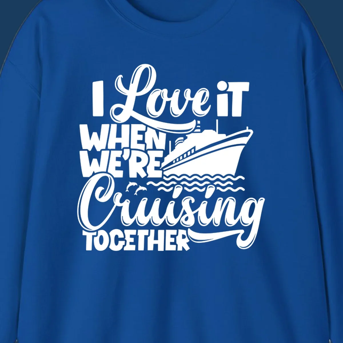 Text 'I Love it When We're Cruising Together' with a cruise ship and dolphins.