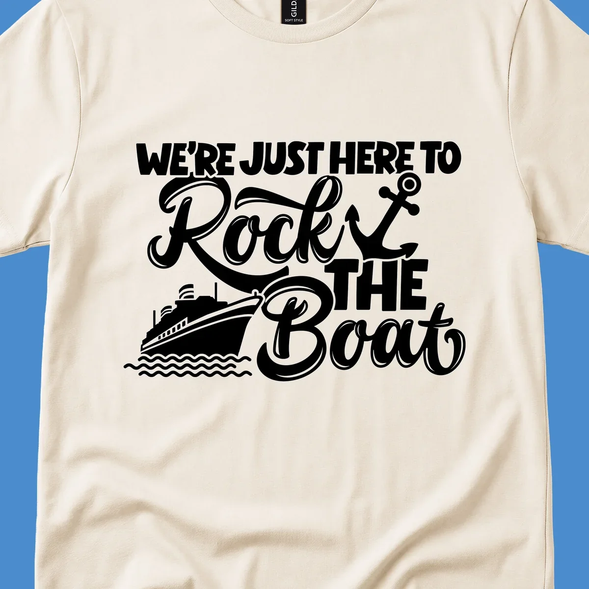 Graphic text design 'We're Just Here To Rock The Boat' with a cruise ship and anchor.