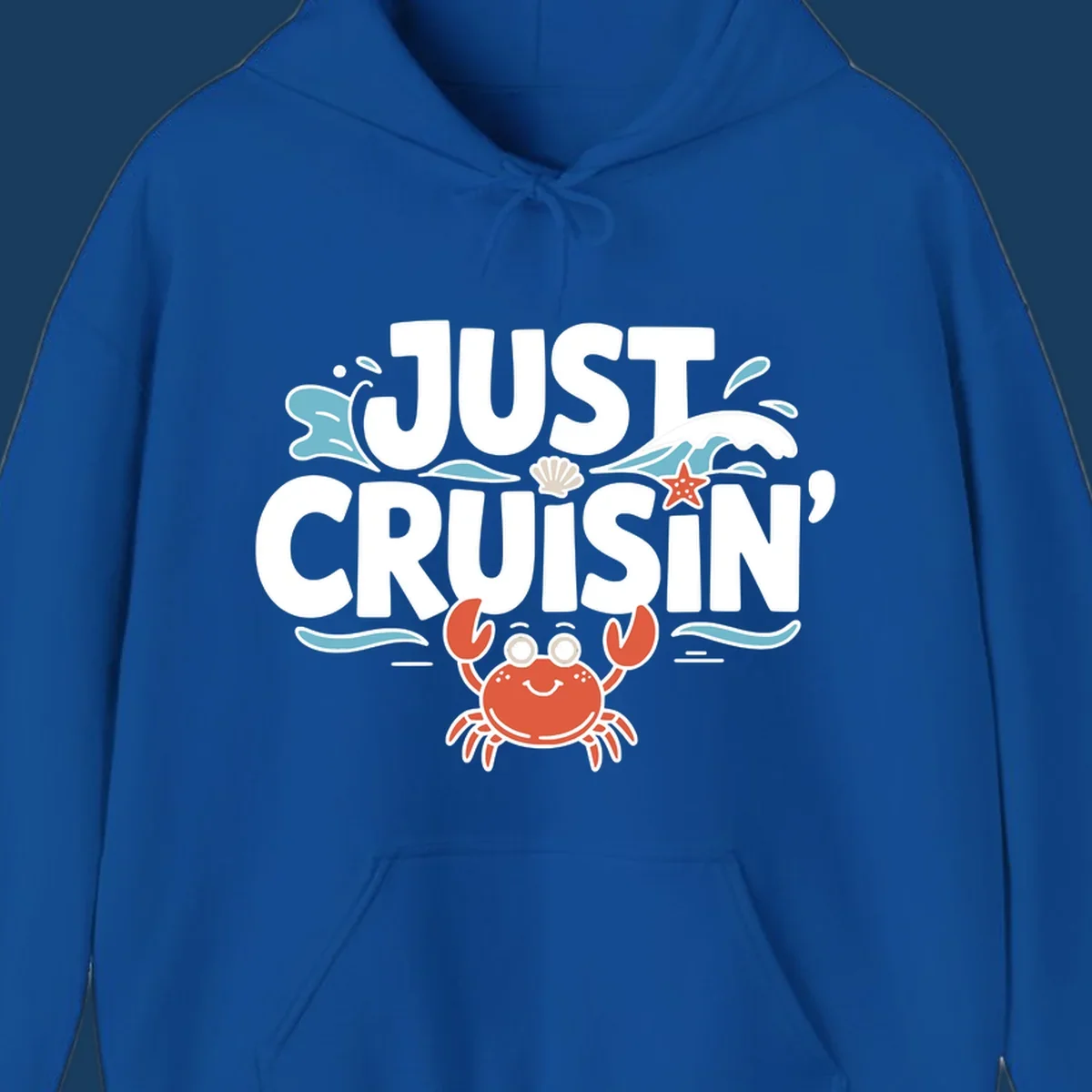 Just Cruisin crab design with waves, seashell, and starfish. Funny cruise vacation theme.