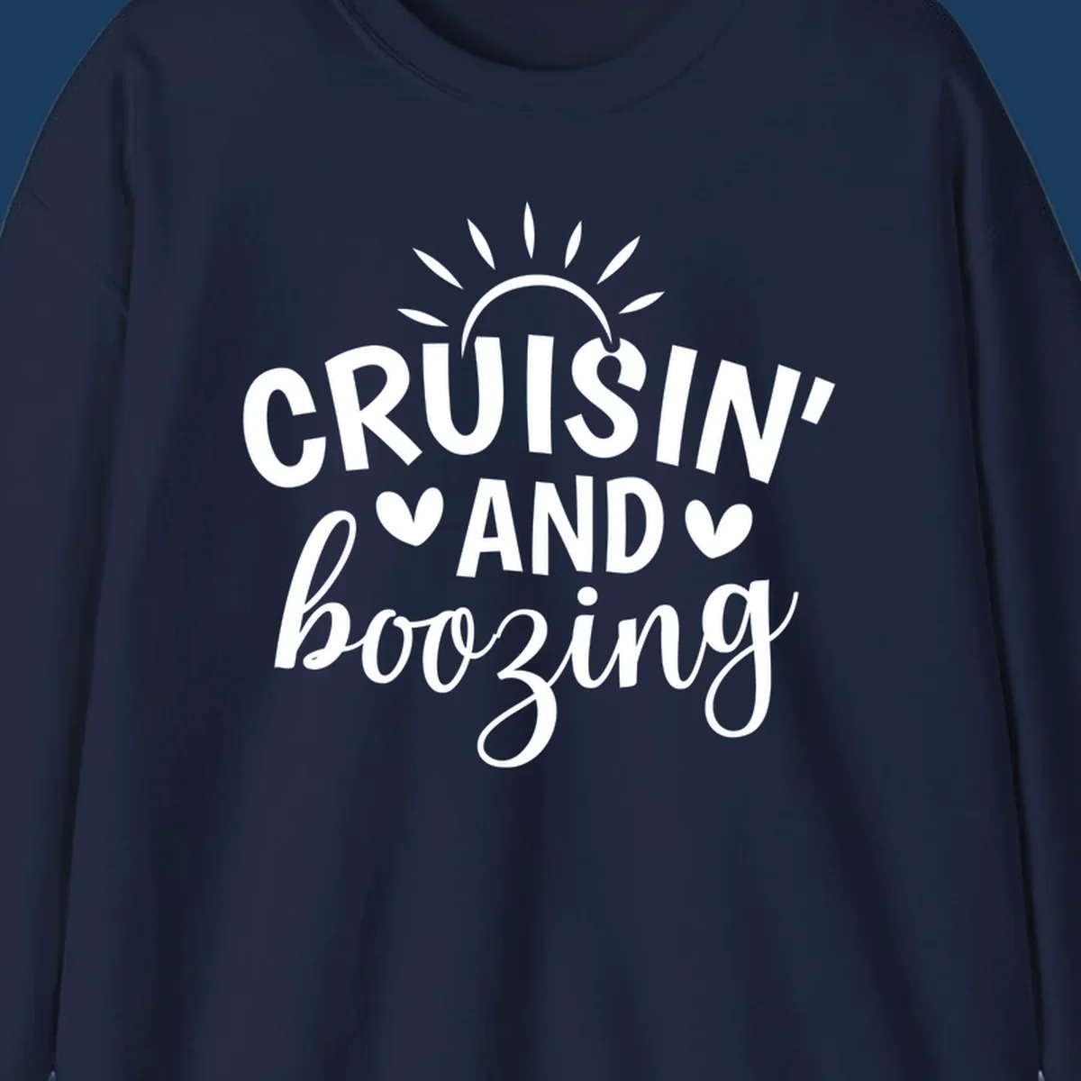 Cruisin' and Boozing text with sun and hearts graphic for a funny cruise shirt.
