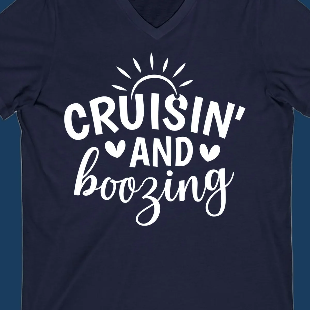 Cruisin' and Boozing text with sun and hearts graphic for a funny cruise shirt.