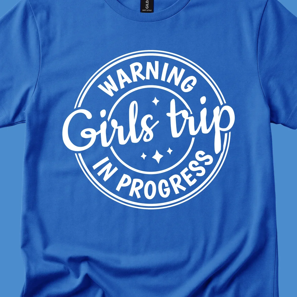 Girls trip in progress warning badge design with text and stars.