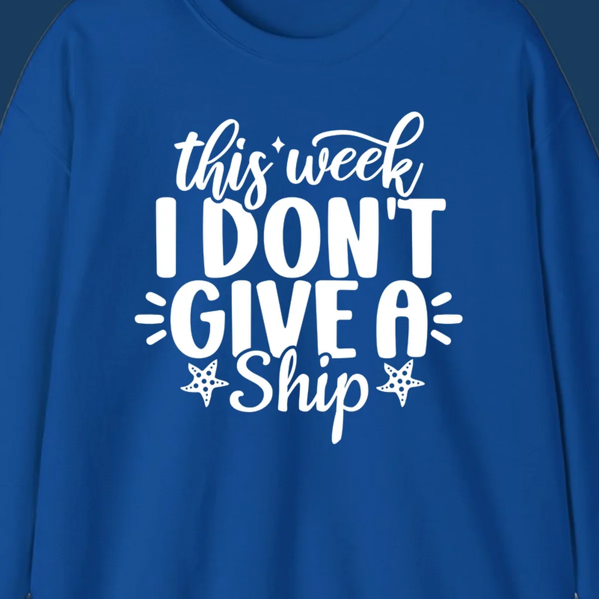 This Week I Don't Give A Ship text design with starfish and sparkles.